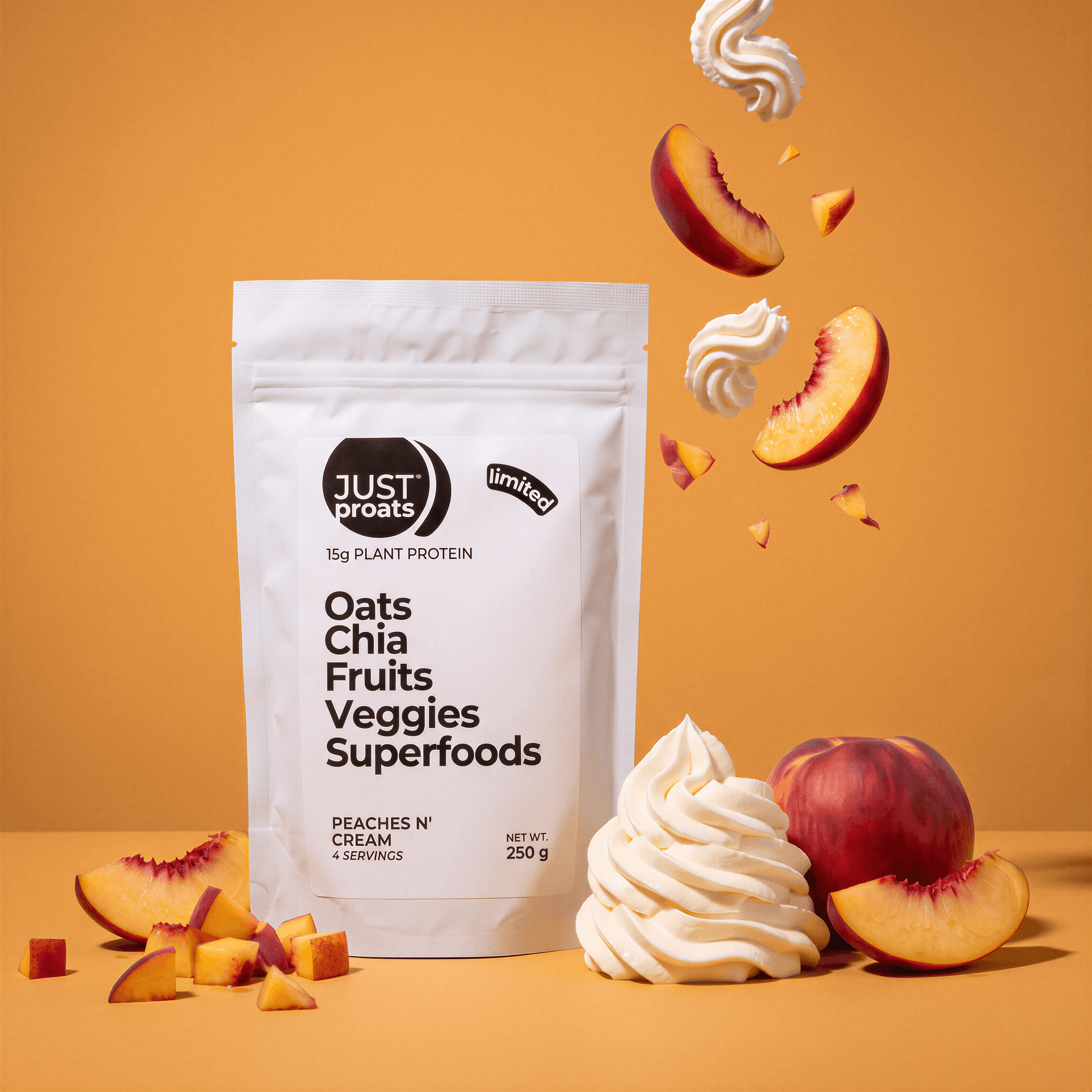 A stand-up pouch of Just Proats plant protein powder in Peaches, n' Cream flavor, styled with peach slices, whipped cream swirls, and whole peaches on a warm orange background.