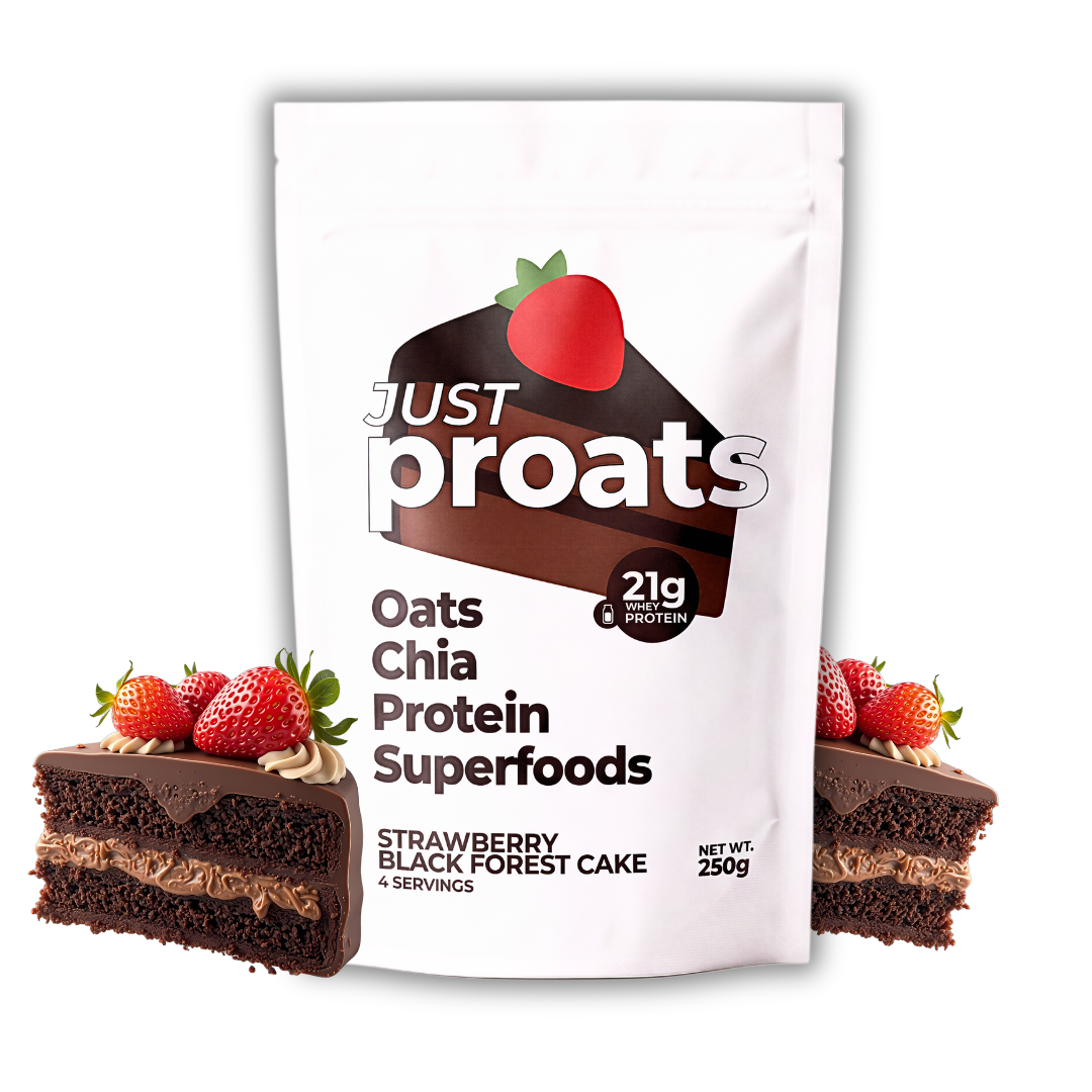 A white stand-up pouch of Just Proats Oats Chia Protein Superfoods, strawberry black forest cake flavor, shown on a white background with two slices of chocolate cake topped with strawberries flanking the package.