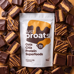 A stand-up pouch of Just Proats Oats Chia Protein Superfoods in Choco PB flavor, surrounded by chocolate protein bars with caramel drizzle on a brown background.