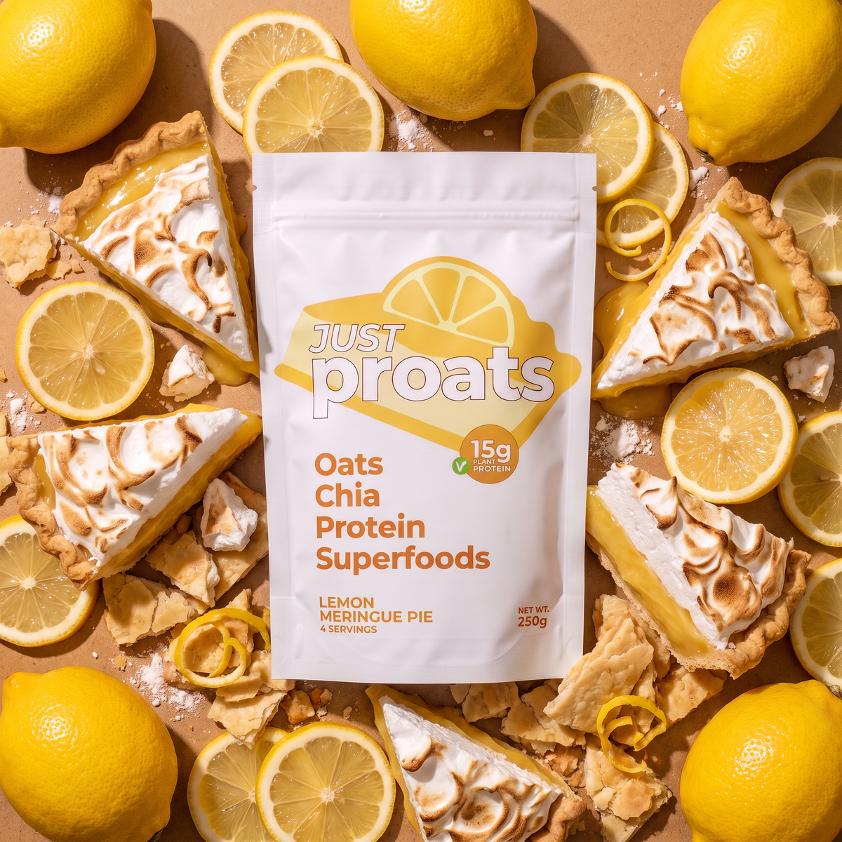 A white stand-up pouch of Just Proats Oats Chia Protein Superfoods, Lemon Meringue Pie flavor, styled in a flat-lay arrangement with lemon slices, whole lemons, and lemon meringue pie tart slices on a tan background.