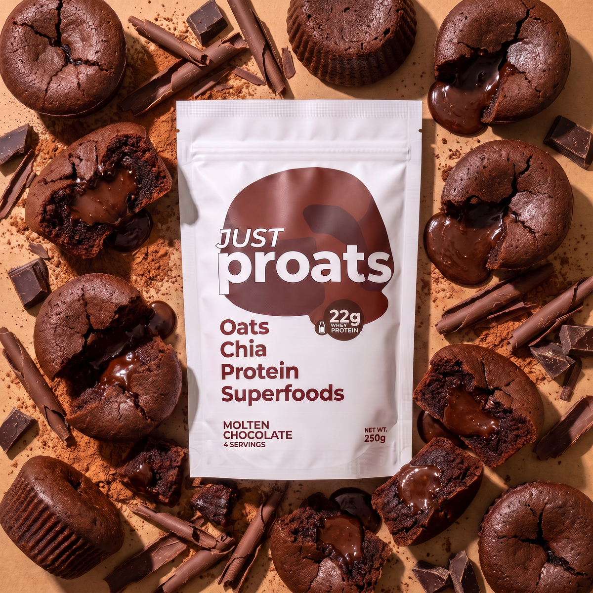 A white stand-up pouch of Just Proats Oats Chia Protein Superfoods surrounded by chocolate lava cakes, chocolate pieces, and cinnamon sticks on a tan background.